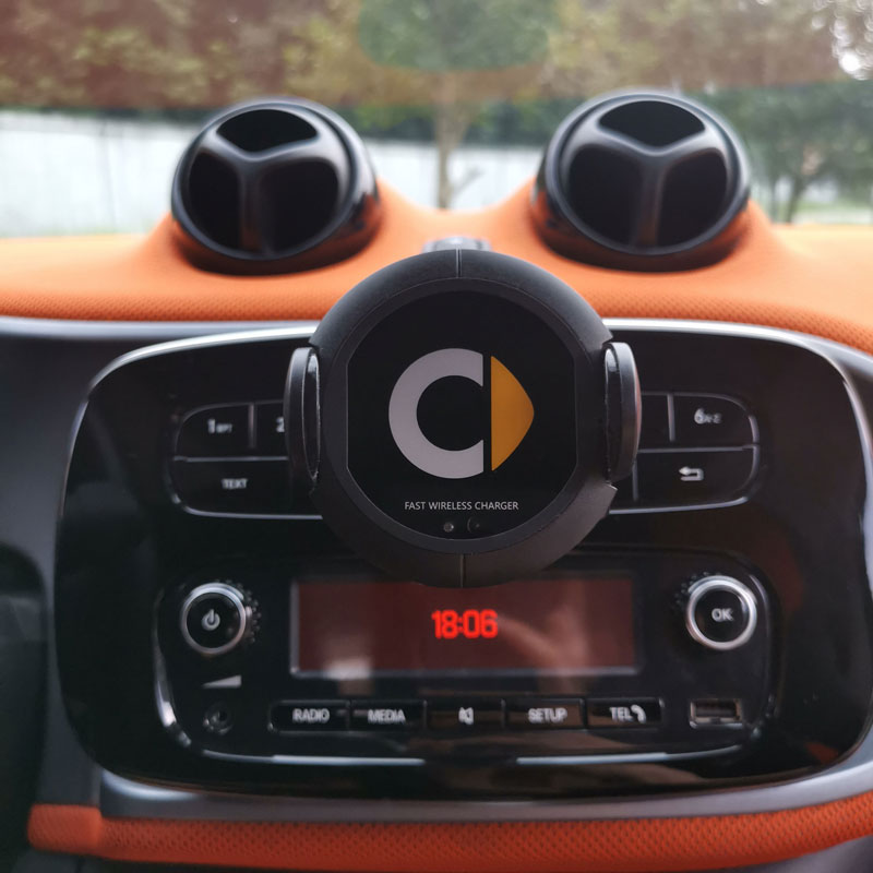 Fast wireless car charger mounted on dashboard